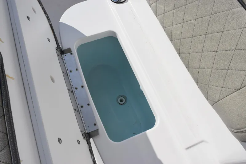 Slide: The Image of Livewell compartment on 2021 Sportsman Heritage 241 Center Console boat. - 16