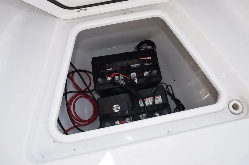 Slide: The Image of Battery compartment of 2021 Sportsman Heritage 241 Center Console boat. - 17