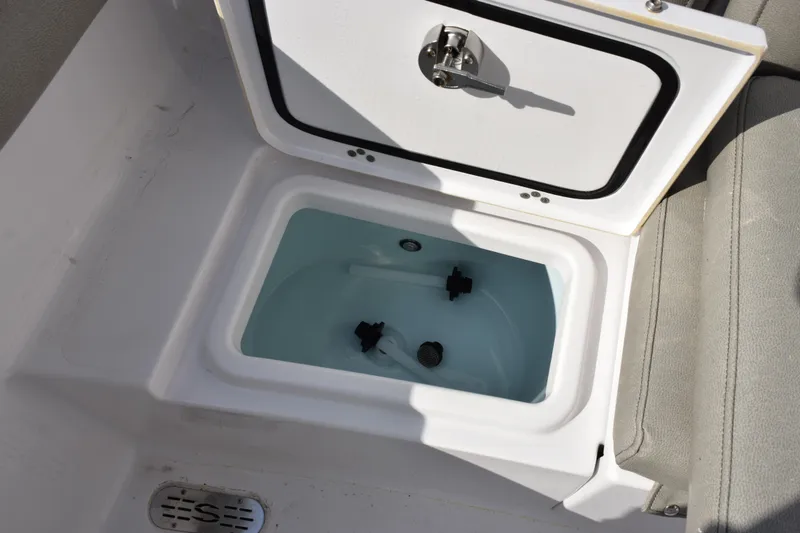 Slide: The Image of Livewell compartment on 2021 Sportsman Heritage 241 Center Console boat. - 22