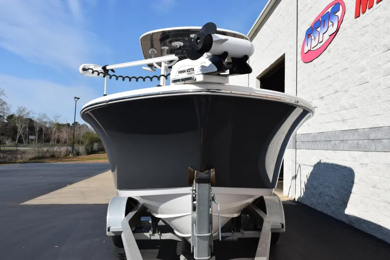 Slide: The Image of 2021 Sportsman Heritage 241 Center Console boat on trailer, parked outside dealership. - 3