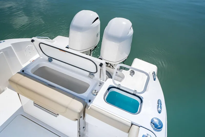 Slide: The Image of 2026 Pursuit DC 266 Dual Console boat with dual engines and open storage compartments. - 4