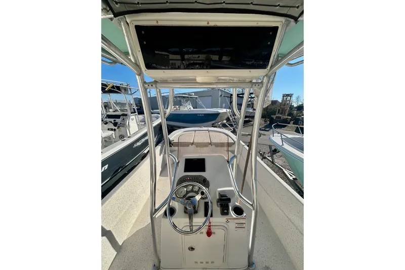 Slide: The Image of 2018 Carolina Skiff 238 DLV boat console with steering wheel and controls. - 5