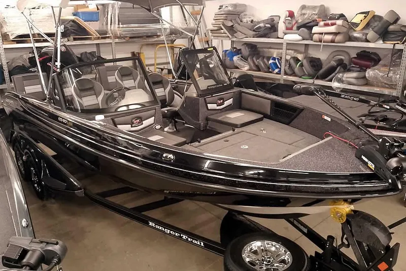 The Image of 2026 Ranger 2050MS Reata boat in showroom, featuring sleek design and modern amenities. - 1