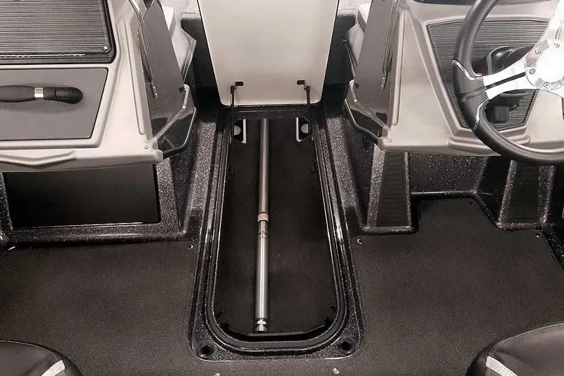 Slide: The Image of 2026 Ranger 2050MS Reata boat interior with storage compartment and steering wheel. - 11