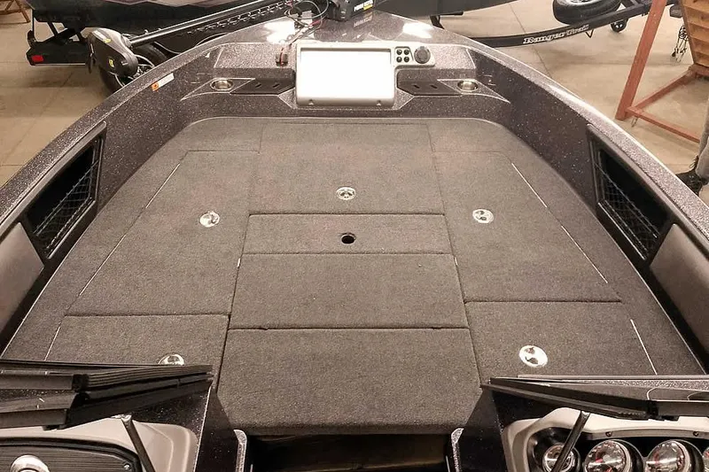 Slide: The Image of 2026 Ranger 2050MS Reata boat interior with spacious deck and modern controls. - 13