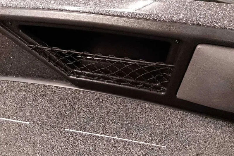 Slide: The Image of Interior storage compartment of 2026 Ranger 2050MS Reata boat with netting. - 16