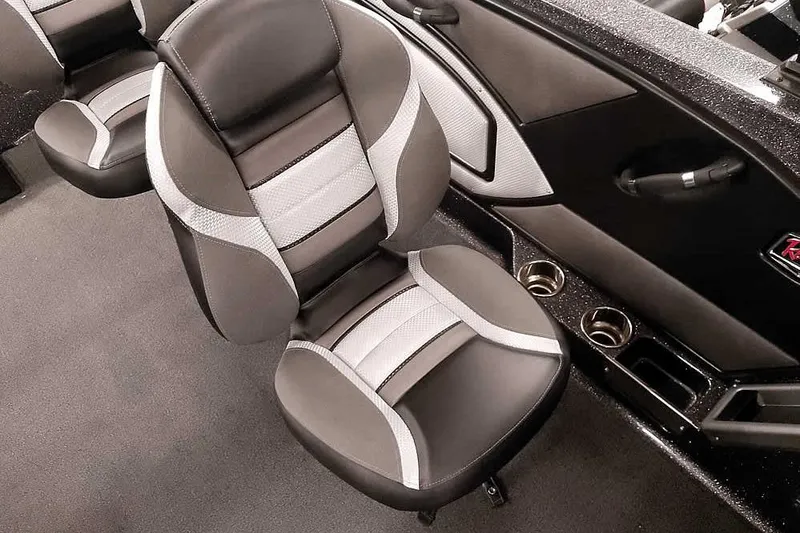 Slide: The Image of 2026 Ranger 2050MS Reata boat interior with stylish seating and cup holders. - 24