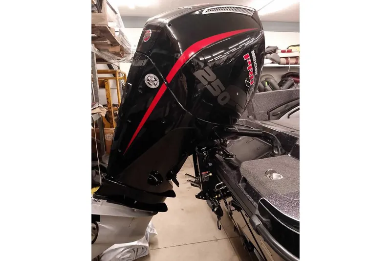 Slide: The Image of 2026 Ranger 2050MS Reata boat with powerful 250 horsepower engine in storage. - 3