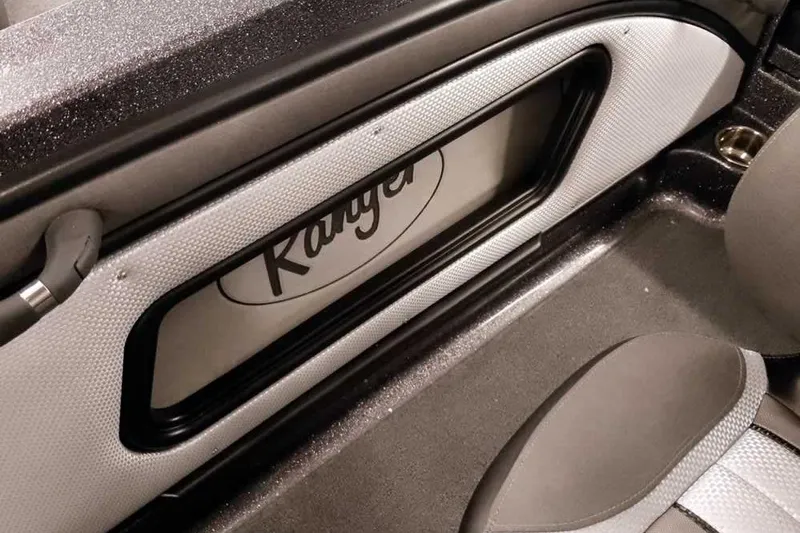Slide: The Image of Interior of 2026 Ranger 2050MS Reata boat, featuring sleek design and branding. - 34