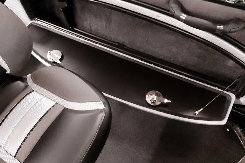 Slide: The Image of Interior view of 2026 Ranger 2050MS Reata boat, featuring seating and storage compartment. - 35