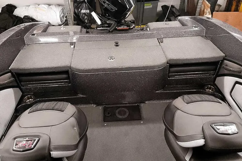 Slide: The Image of 2026 Ranger 2050MS Reata boat interior with cushioned seating and storage compartments. - 36