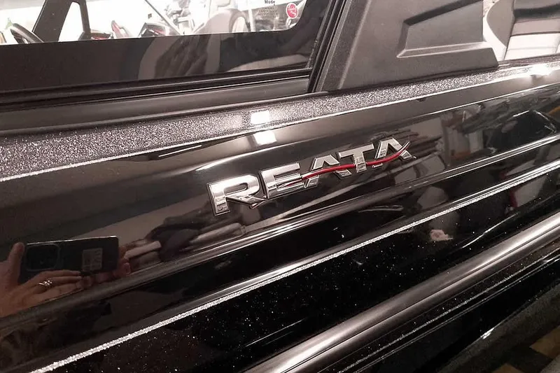 Slide: The Image of 2026 Ranger 2050MS Reata boat with sleek black finish and Reata logo. - 8