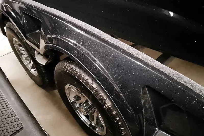 Slide: The Image of 2026 Ranger 2050MS Reata trailer with chrome wheels and black fender detail. - 9