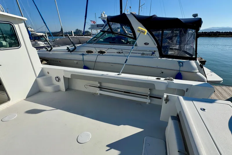 Slide: The Image of 2021 Parker 2820 XLD Sport Cabin docked beside another boat in a marina. - 10