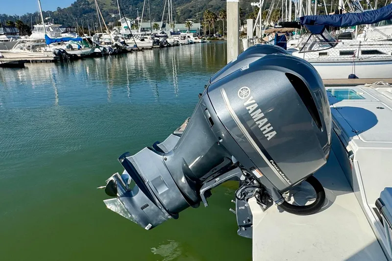 Slide: The Image of 2021 Parker 2820 XLD Sport Cabin with Yamaha outboard motor in marina setting. - 14