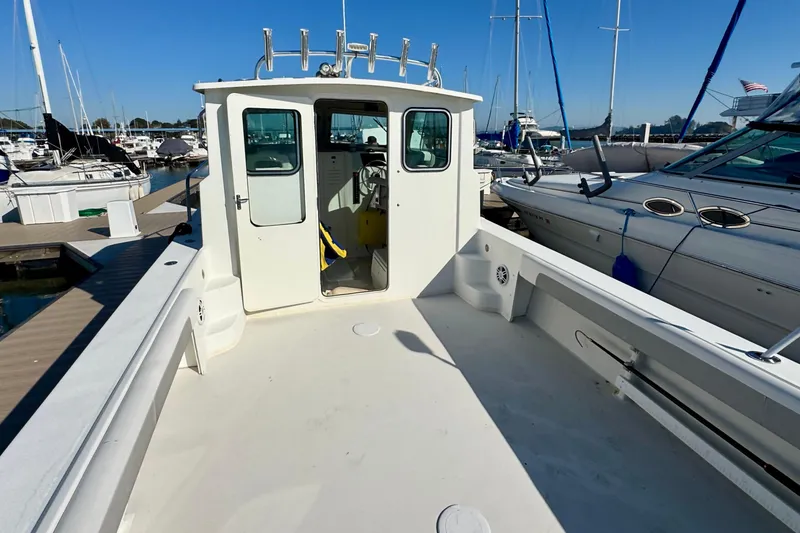 Slide: The Image of 2021 Parker 2820 XLD Sport Cabin boat docked at marina, rear view. - 9