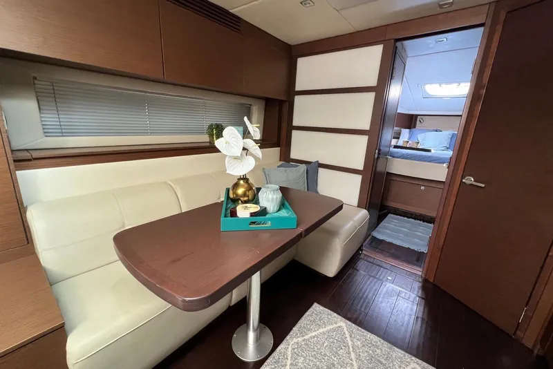 Slide: The Image of Luxurious interior of 2012 Sea Ray 450 Sundancer yacht with elegant dining area. - 15