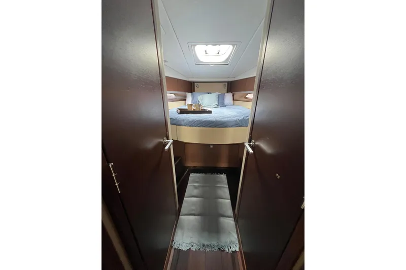 Slide: The Image of Luxurious cabin interior of 2012 Sea Ray 450 Sundancer yacht with cozy bedding. - 18