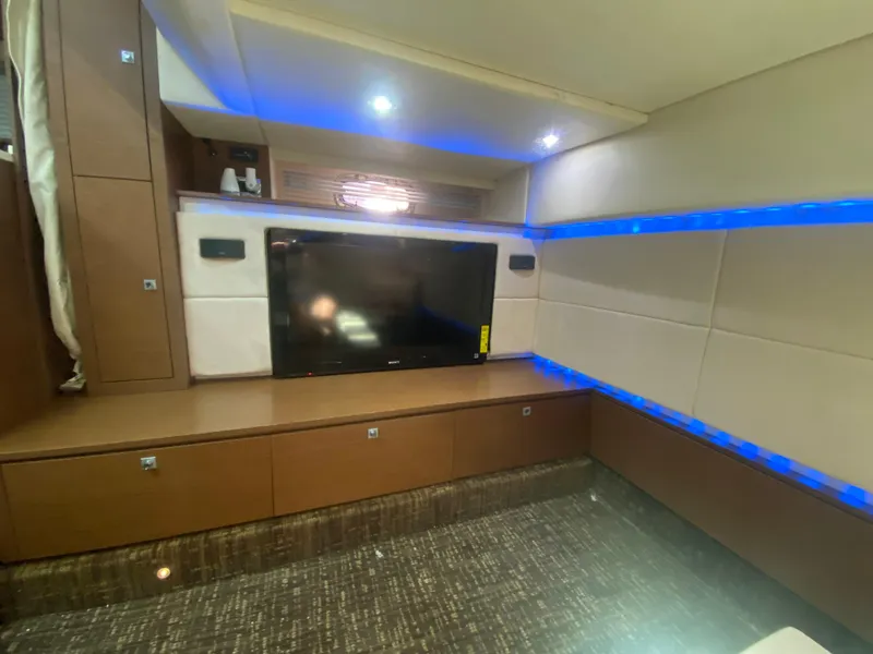 Slide: The Image of Luxurious interior of 2012 Sea Ray 450 Sundancer with TV and ambient lighting. - 25
