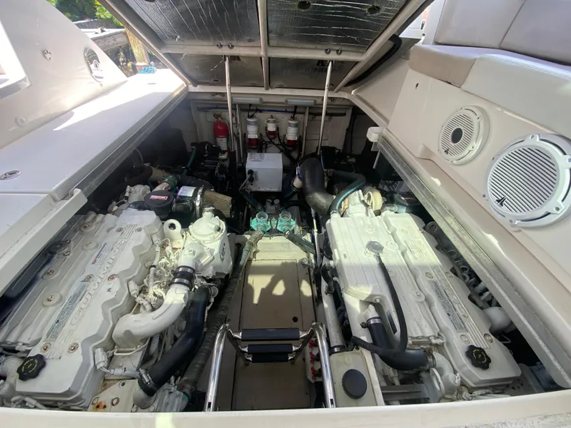 Slide: The Image of Engine compartment of a 2012 Sea Ray 450 Sundancer boat, showcasing dual engines. - 27