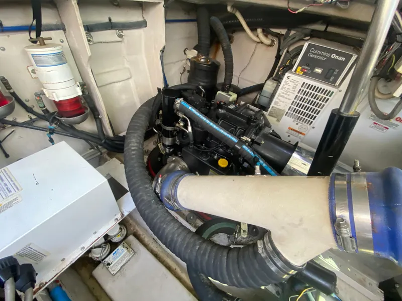 Slide: The Image of Engine room of 2012 Sea Ray 450 Sundancer with Cummins Onan generator and mechanical components. - 28