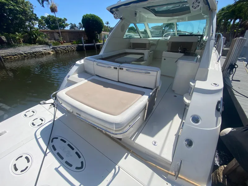 Slide: The Image of 2012 Sea Ray 450 Sundancer yacht with spacious deck and seating area. - 3