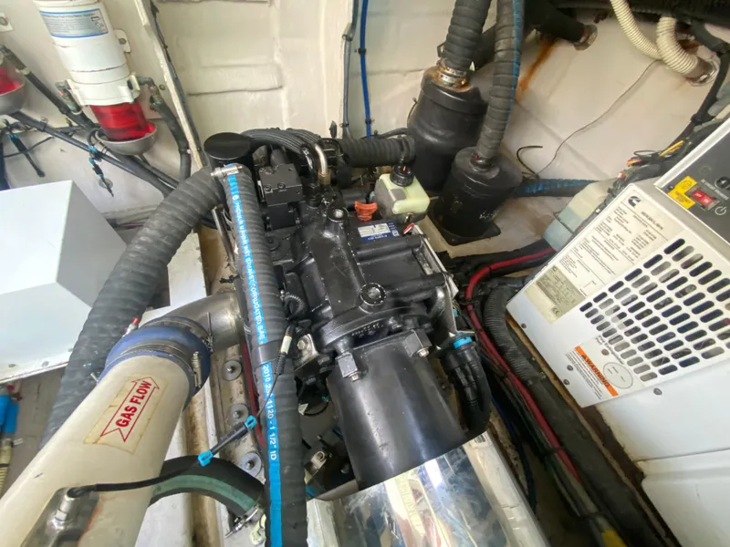 Slide: The Image of Engine room of 2012 Sea Ray 450 Sundancer with visible components and wiring. - 34