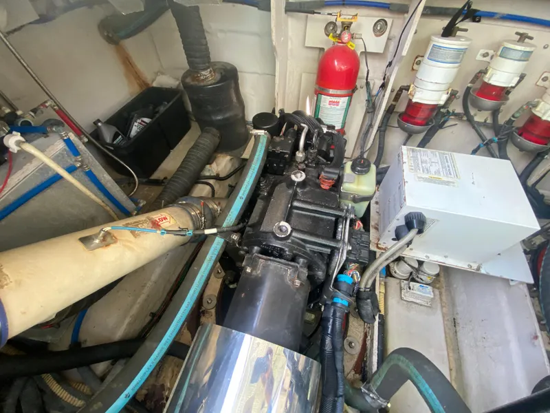 Slide: The Image of Engine room of 2012 Sea Ray 450 Sundancer with visible components and fire extinguisher. - 35