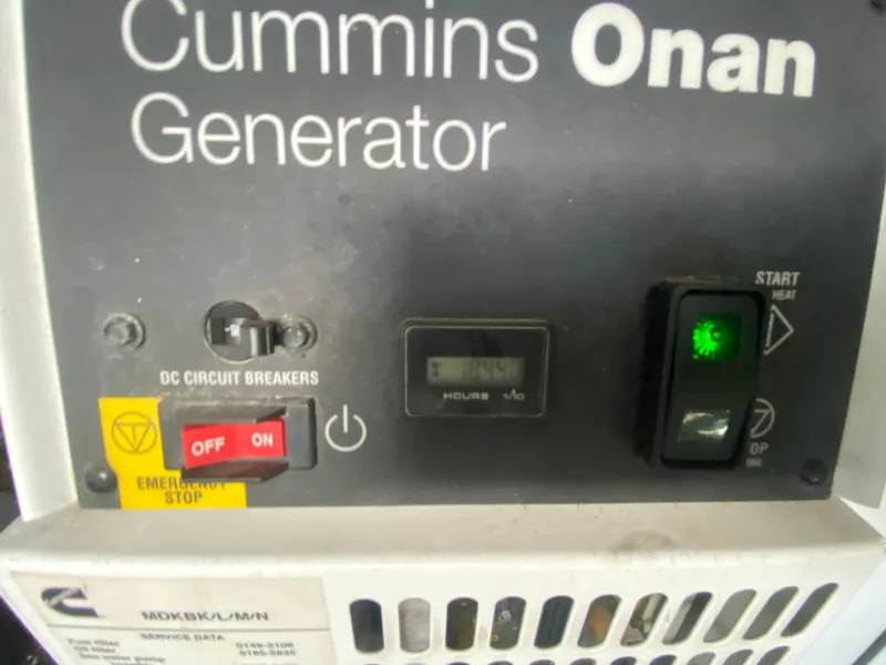 Slide: The Image of Cummins Onan generator control panel on a 2012 Sea Ray 450 Sundancer yacht. - 37