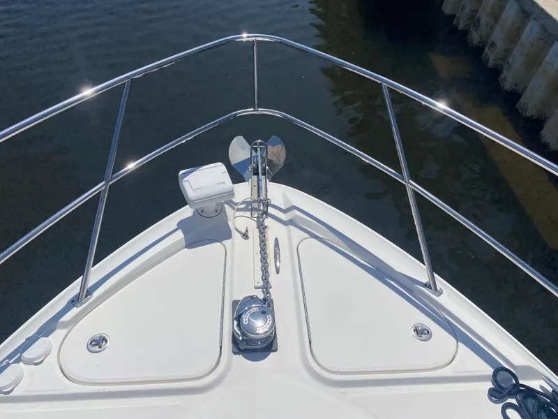 Slide: The Image of Bow of 2012 Sea Ray 450 Sundancer with anchor and railing in marina. - 39