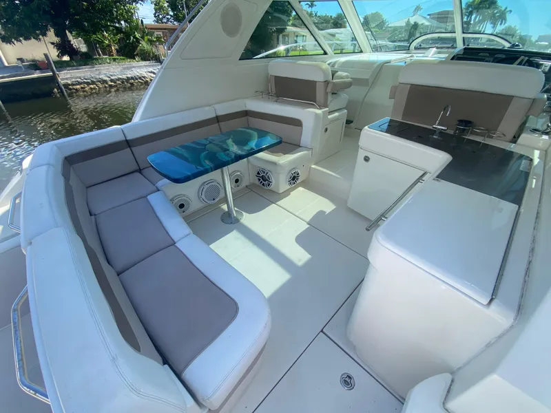 Slide: The Image of Luxurious interior of 2012 Sea Ray 450 Sundancer yacht with seating and table. - 4