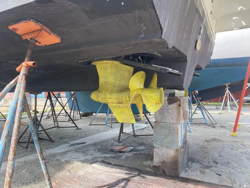 Slide: The Image of 2012 Sea Ray 450 Sundancer boat propeller and hull on dry dock. - 49
