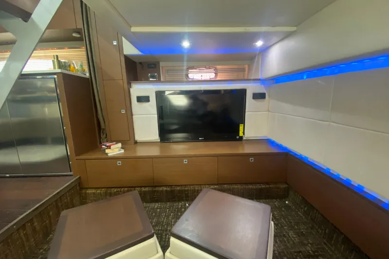 Slide: The Image of Luxurious interior of 2012 Sea Ray 450 Sundancer yacht with modern entertainment setup. - 53