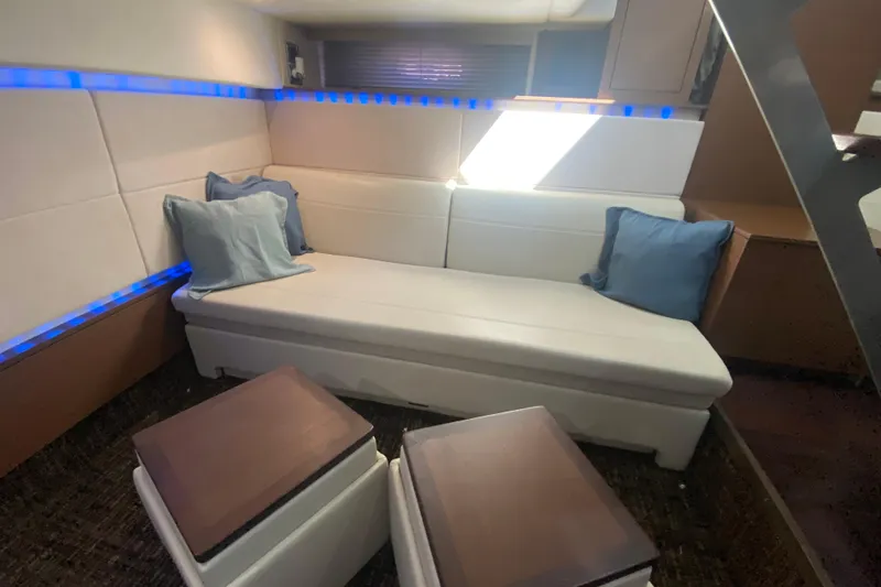Slide: The Image of Luxurious interior of 2012 Sea Ray 450 Sundancer with modern seating and ambient lighting. - 54