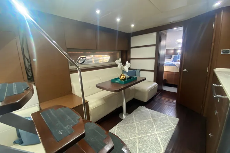 Slide: The Image of Luxurious interior of 2012 Sea Ray 450 Sundancer yacht with elegant seating and modern decor. - 55