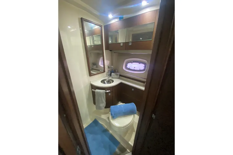 Slide: The Image of Luxurious bathroom in 2012 Sea Ray 450 Sundancer yacht with modern fixtures and elegant design. - 56