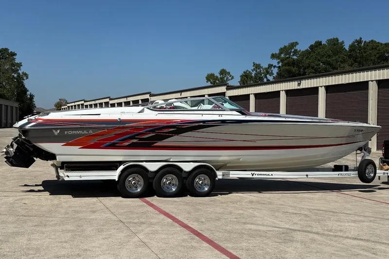Slide: The Image of 2007 Formula 353 FASTech speedboat on trailer, featuring sleek design and vibrant graphics. - 1