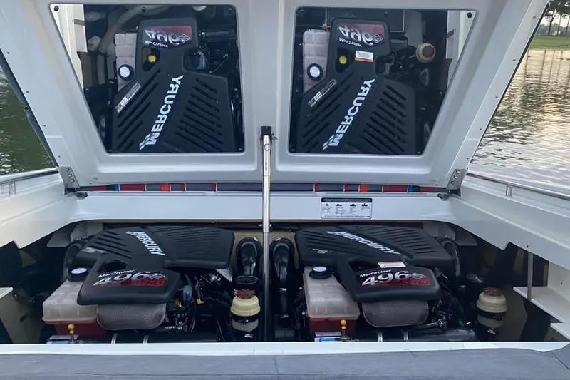 Slide: The Image of 2007 Formula 353 FASTech boat with dual Mercury engines, open engine compartment view. - 16