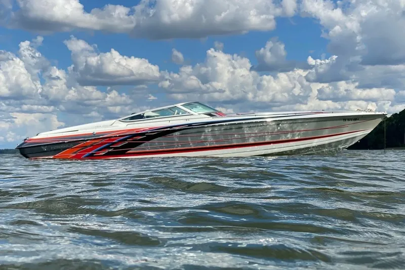 Slide: The Image of 2007 Formula 353 FASTech speedboat on water under cloudy sky. - 2