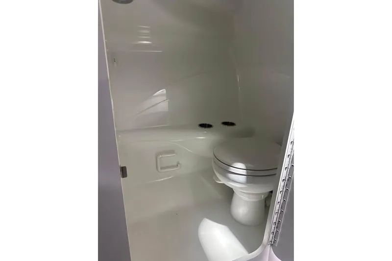 Slide: The Image of 2007 Formula 353 FASTech boat bathroom interior with white toilet and sleek design. - 21