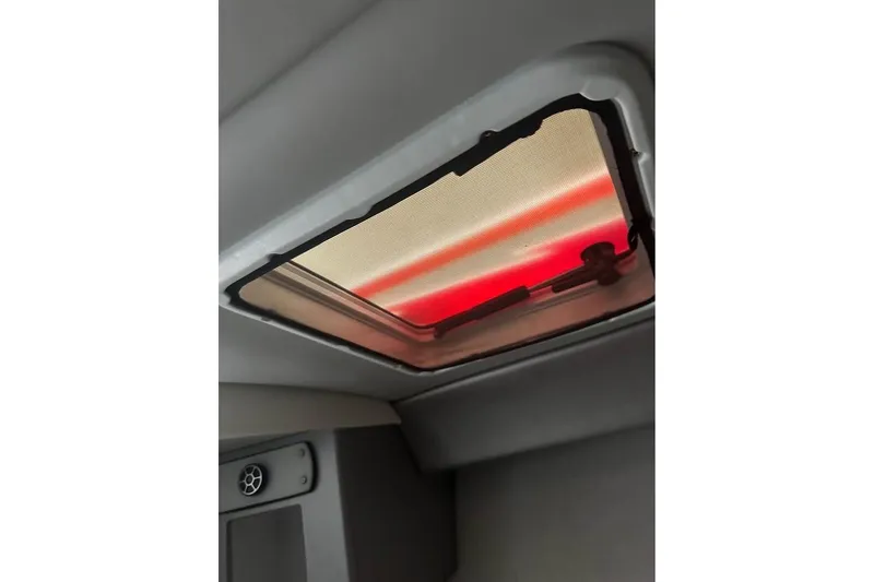 Slide: The Image of Interior view of a 2007 Formula 353 FASTech boat's hatch with red-tinted light. - 22