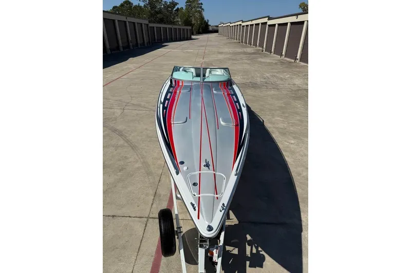 Slide: The Image of 2007 Formula 353 FASTech boat with sleek design and vibrant red and blue accents. - 5