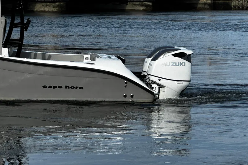 Slide: The Image of 2024 Cape Horn 32 T boat with Suzuki outboard engines on water. - 6
