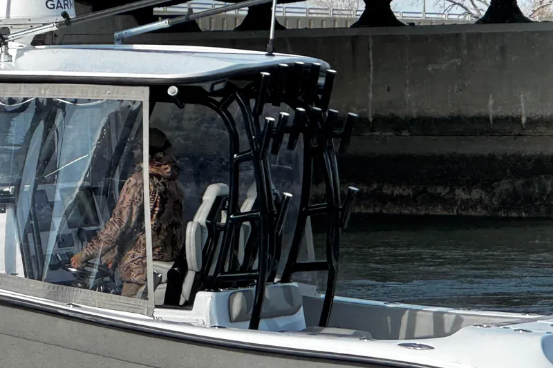 Slide: The Image of 2024 Cape Horn 32 T boat with person navigating, featuring modern design and equipment. - 7