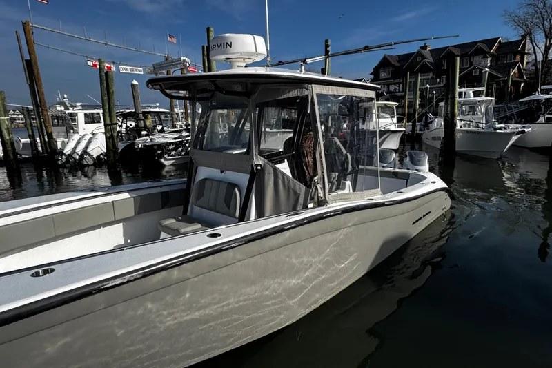 Slide: The Image of 2024 Cape Horn 32 T boat docked at marina, featuring sleek design and advanced navigation equipment. - 3