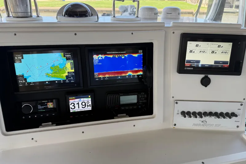 Slide: The Image of 2002 Regulator 23 Classic boat dashboard with navigation and control displays. - 8