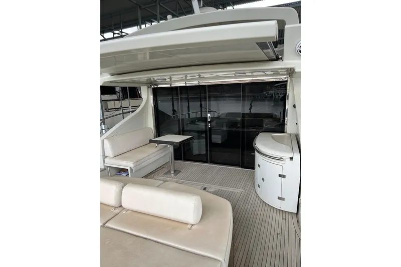 Slide: The Image of Luxury 2006 Azimut 68S yacht interior with seating and sleek design. - 11