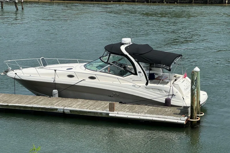 The Image of 2007 Sea Ray 340 Sundancer yacht docked on calm water. - 0
