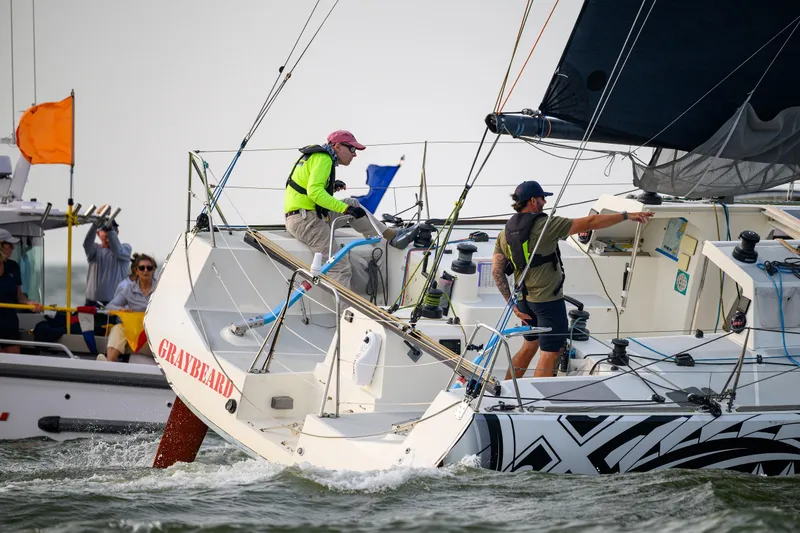 The Image of Sailors maneuvering 2007 Class 40 Akilaria yacht "Graybeard" during a race. - 0