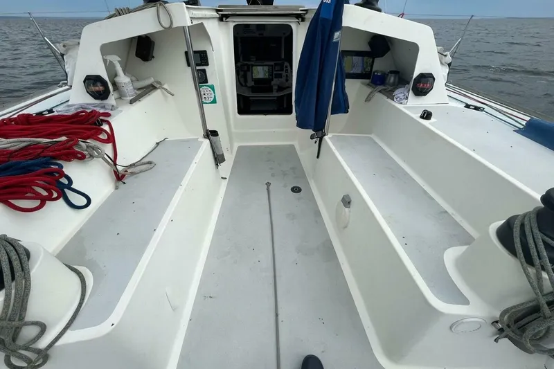 Slide: The Image of Cockpit of 2007 Class 40 Akilaria sailboat with ropes and equipment. - 12